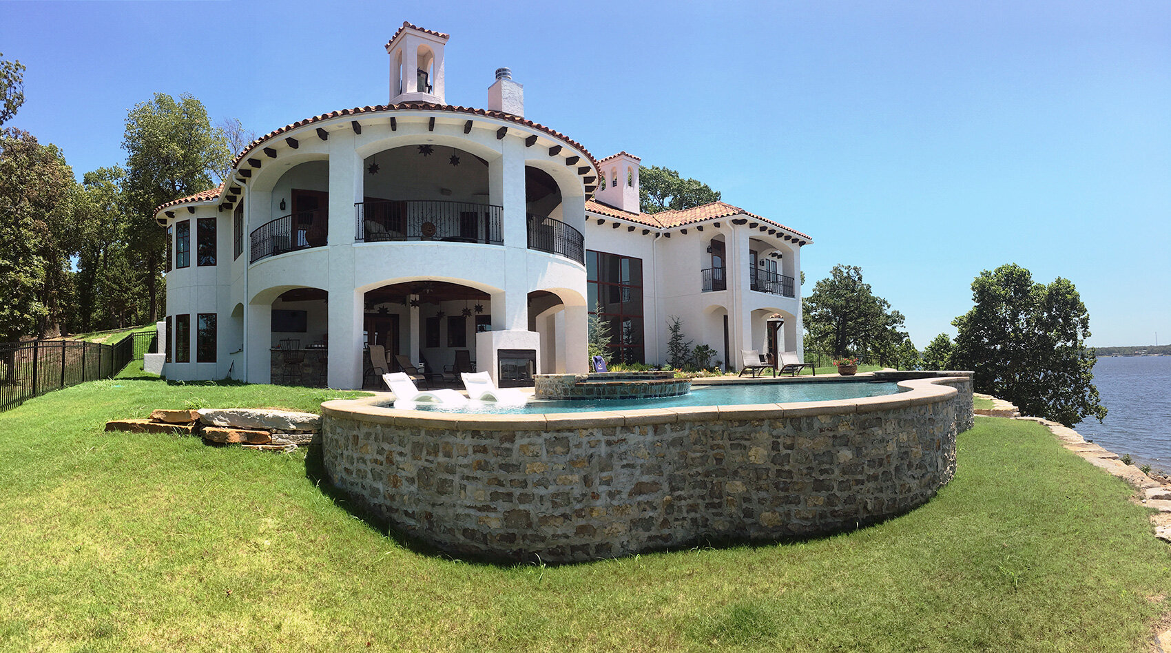 lakeside home featuring wood windows